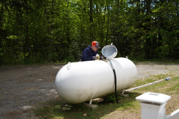 Lake Region Energy staff member refilling propane tank