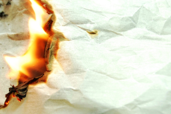 burning paper depicting burning smell