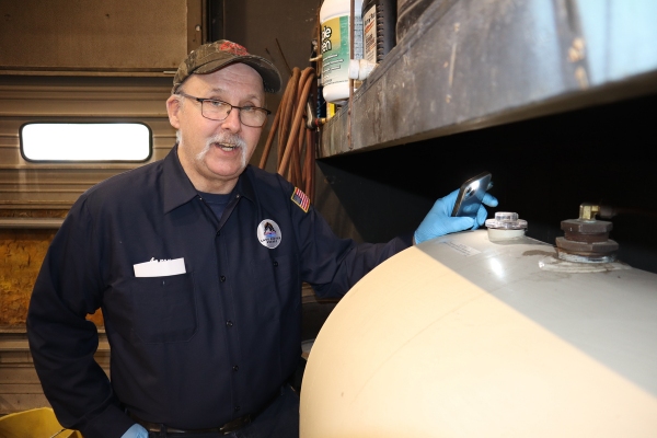 Lake Region Energy staff doing oil tank inspection