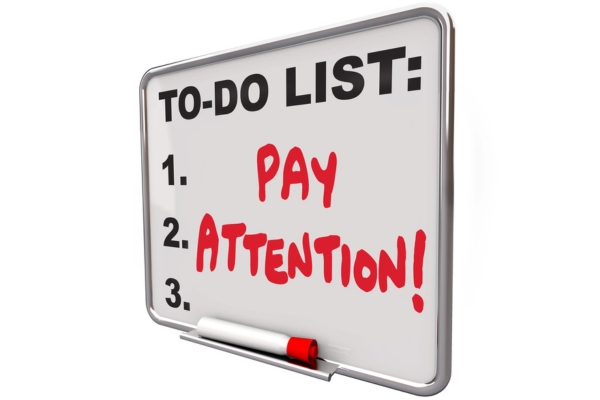 Pay Attention as to do list written on white board