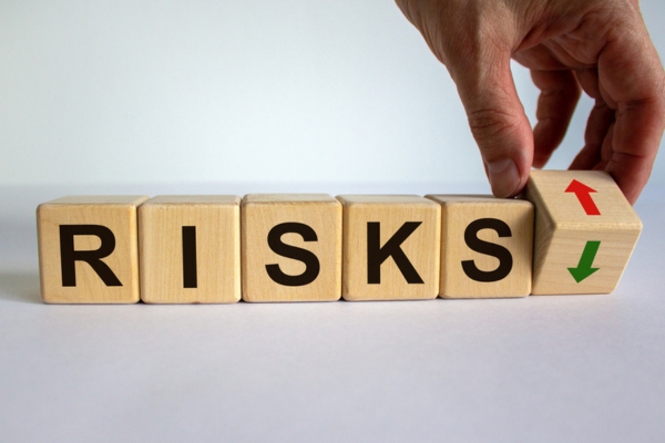 risks spelled using wooden letter depicting oil tank condensation risks