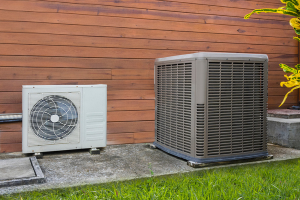 heat pump and air conditioner installed side-by-side depicting similarities