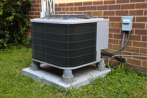 residential air conditioner installed outside the house