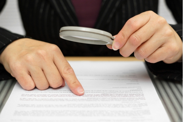 Homeowner carefully reading propane delivery service contract