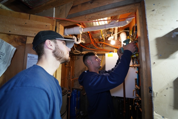 Lake Region Energy HVAC technicians on work site