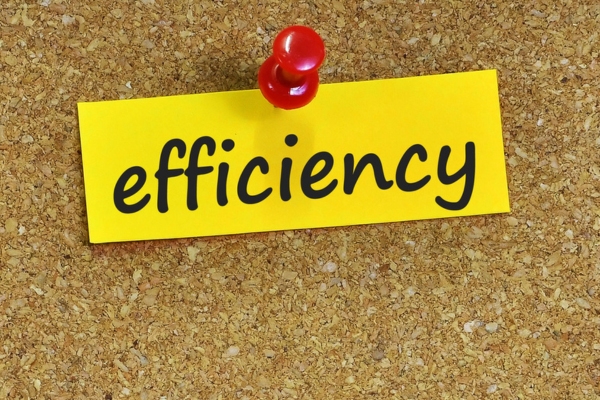 Efficiency word on a yellow sticky note depicting fuel oil