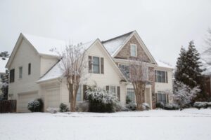 house and street after snow during winter