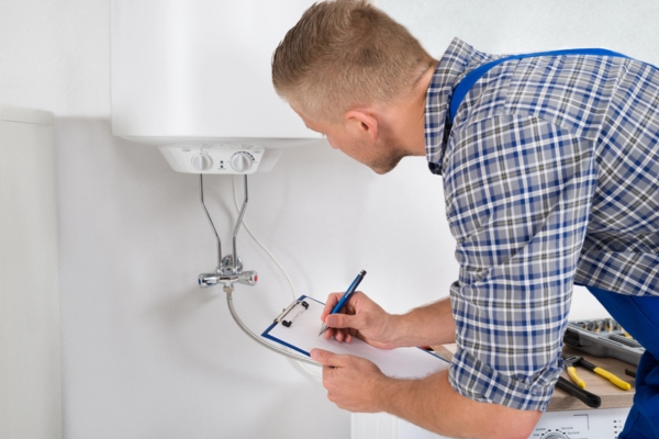 professional HVAC technician doing a comprehensive winter maintenance using a detailed checklist