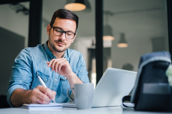 image of a man doing a comparative research between will call and automatic oil delivery