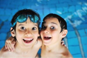 kids enjoying swimming at a heated pool