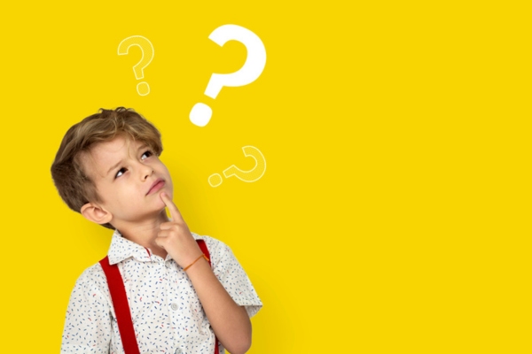 kid looking at question marks depicting FAQs about boiler lifespan